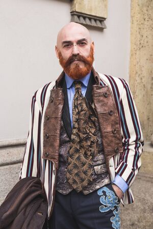 MILAN, ITALY - FEBRUARY 25: People gather outside Luisa Beccaria fashion show building for Milan Women's Fashion Week on FEBRUARY 25, 2016 in Milan.のeditorial素材