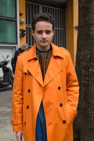 MILAN, ITALY - FEBRUARY 26: Fashionable man outside Emporio Armani fashion show during Milan Women's Fashion Week on FEBRUARY 26, 2016 in Milan.のeditorial素材