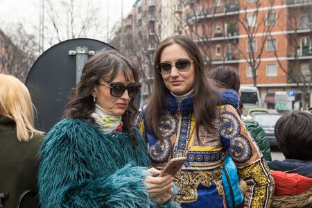 MILAN, ITALY - FEBRUARY 26: People gather outside Emporio Armani fashion show during Milan Women's Fashion Week on FEBRUARY 26, 2016 in Milan.のeditorial素材