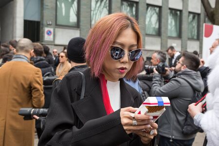 MILAN, ITALY - FEBRUARY 26: People gather outside Emporio Armani fashion show during Milan Women's Fashion Week on FEBRUARY 26, 2016 in Milan.のeditorial素材