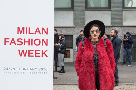 MILAN, ITALY - FEBRUARY 26: Fashionable woman outside Emporio Armani fashion show during Milan Women's Fashion Week on FEBRUARY 26, 2016 in Milan.のeditorial素材