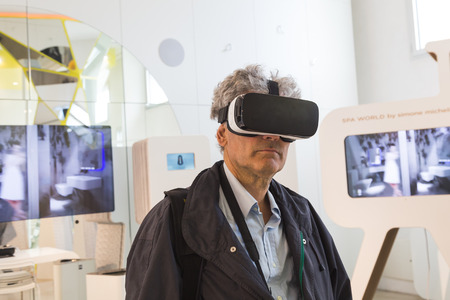 MILAN, ITALY - APRIL 12: Man tries virtual reality headset for Fuorisalone at Ventura Lambrate space, location of important events during Milan Design Week on APRIL 12, 2016 in Milan.のeditorial素材