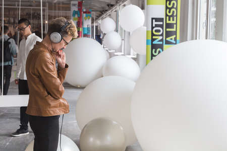 MILAN, ITALY - APRIL 13: People visit Fuorisalone, set of events distributed in different areas of the town during Milan Design Week on APRIL 13, 2016 in Milan.のeditorial素材
