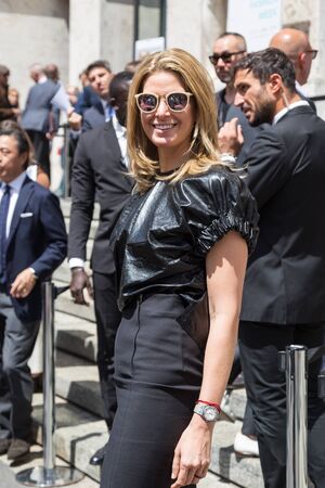 MILAN, ITALY - JUNE 19: Fashionable woman poses outside Ferragamo fashion show building during Milan Men's Fashion Week on JUNE 19, 2016 in Milan.のeditorial素材