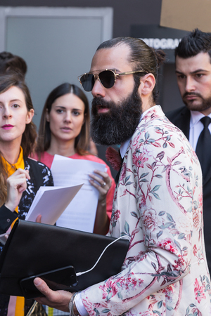 MILAN, ITALY - JUNE 20: Fashionable people gather outside Etro fashion show building during Milan Men's Fashion Week on JUNE 20, 2016 in Milan.のeditorial素材