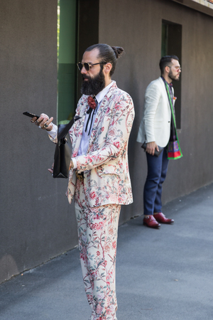MILAN, ITALY - JUNE 20: Fashionable man poses outside Etro fashion show building during Milan Men's Fashion Week on JUNE 20, 2016 in Milan.のeditorial素材