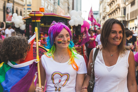 MILAN, ITALY - JUNE 25: People at Pride parade in Milan JUNE 25, 2016. Thousands of people march in the city streets for the annual Pride parade, claiming equality and legal rights.のeditorial素材