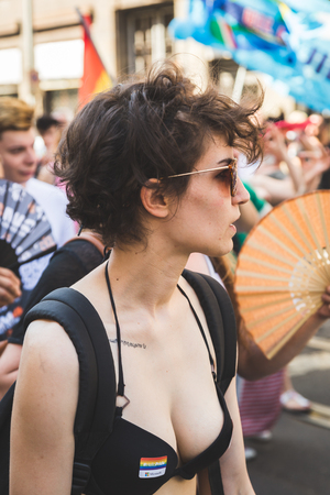 MILAN, ITALY - JUNE 25: People at Pride parade in Milan JUNE 25, 2016. Thousands of people march in the city streets for the annual Pride parade, claiming equality and legal rights.のeditorial素材