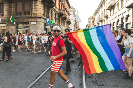 MILAN, ITALY - JUNE 25: People at Pride parade in Milan JUNE 25, 2016. Thousands of people march in the city streets for the annual Pride parade, claiming equality and legal rights.のeditorial素材