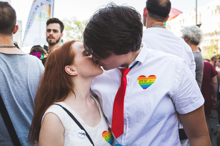 MILAN, ITALY - JUNE 25: People at Pride parade in Milan JUNE 25, 2016. Thousands of people march in the city streets for the annual Pride parade, claiming equality and legal rights.のeditorial素材