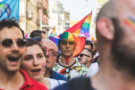 MILAN, ITALY - JUNE 25: People at Pride parade in Milan JUNE 25, 2016. Thousands of people march in the city streets for the annual Pride parade, claiming equality and legal rights.のeditorial素材