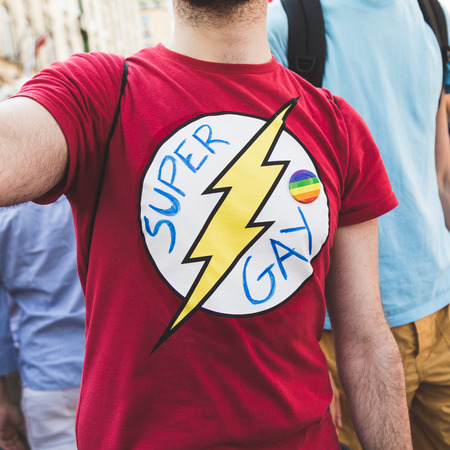 MILAN, ITALY - JUNE 25: People at Pride parade in Milan JUNE 25, 2016. Thousands of people march in the city streets for the annual Pride parade, claiming equality and legal rights.のeditorial素材
