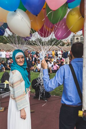 MILAN, ITALY - JULY 7: Muslim people take part in Eid, public celebration for the end of Ramadan on JULY 7, 2016 in Milan.のeditorial素材