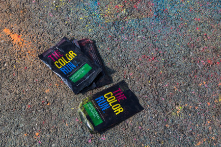 MILAN, ITALY - SEPTEMBER 3: Empty bags of colorful powder at the Color Run event, the funniest and...