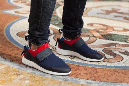 MILAN, ITALY - AUGUST 11: Detail of a fashionable man poses downtown in the fashion district on AUGUST 11, 2016 in Milan.のeditorial素材