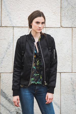 MILAN, ITALY - SEPTEMBER 22, 2016: Gorgeous model poses outside Genny fashion show building during Milan Women Fashion Week SS17.のeditorial素材