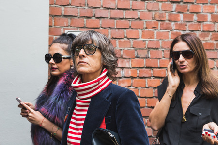 MILAN, ITALY - SEPTEMBER 22, 2016: Fashionable people gather outside Fendi fashion show building during Milan Women Fashion Week SS17.のeditorial素材