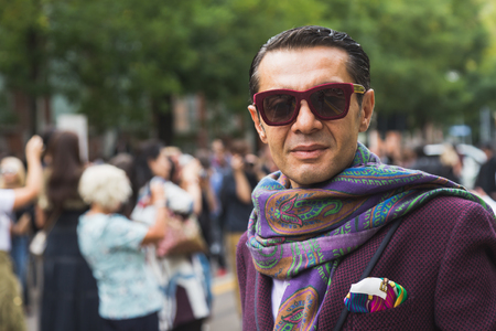 MILAN, ITALY - SEPTEMBER 22, 2016: Fashionable man poses outside Fendi fashion show building during Milan Women Fashion Week SS17.のeditorial素材