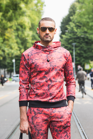MILAN, ITALY - SEPTEMBER 22, 2016: Fashionable man poses outside Fendi fashion show building during Milan Women Fashion Week SS17.のeditorial素材