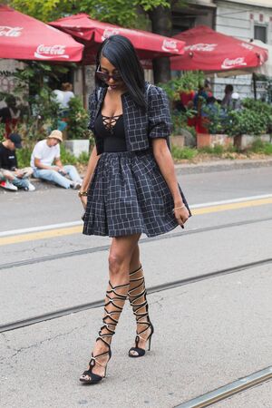 MILAN, ITALY - SEPTEMBER 22, 2016: Fashionable woman poses outside Fendi fashion show building during Milan Women Fashion Week SS17.のeditorial素材