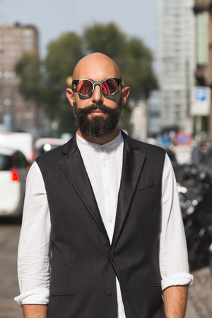 MILAN, ITALY - SEPTEMBER 23, 2016: Fashionable man poses outside Marco De Vincenzo fashion show building during Milan Women Fashion Week SS17.のeditorial素材
