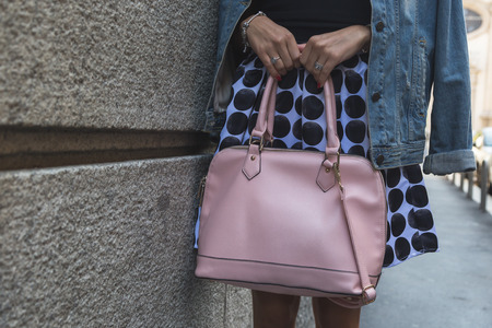 MILAN, ITALY - SEPTEMBER 24, 2016: Detail of bag outside Blumarine fashion show building during Milan Women Fashion Week SS17.のeditorial素材
