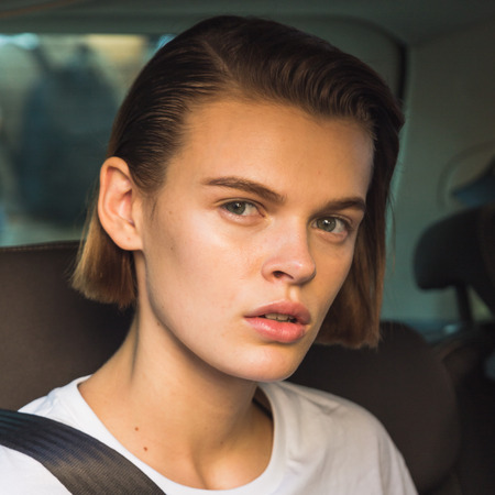 MILAN, ITALY - SEPTEMBER 25, 2016: Beautiful model outside Ferragamo fashion show building during Milan Women Fashion Week SS17.のeditorial素材