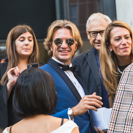 MILAN, ITALY - SEPTEMBER 25, 2016: Fashionable people gather outside Ferragamo fashion show building during Milan Women Fashion Week SS17.のeditorial素材