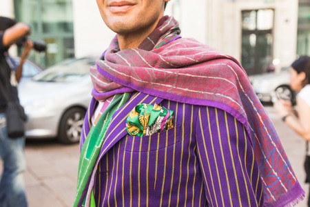 MILAN, ITALY - SEPTEMBER 25, 2016: Detail of a fashionable man poses outside Ferragamo fashion show building during Milan Women Fashion Week SS17.のeditorial素材