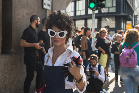 MILAN, ITALY - SEPTEMBER 24, 2016: Fashionable woman poses outside Ermanno Scervino fashion show building during Milan Women Fashion Week SS17.のeditorial素材