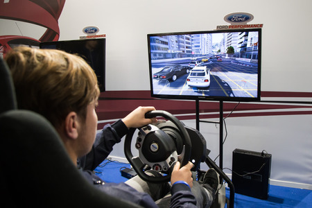 MILAN, ITALY - OCTOBER 14: People play at Games Week 2016, event dedicated to video games and electronic entertainment on OCTOBER 14, 2016 in Milan.のeditorial素材