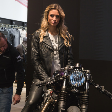 MILAN, ITALY - NOVEMBER 8: Model poses at EICMA, international motorcycle exhibition on NOVEMBER 8, 2016 in Milan.のeditorial素材