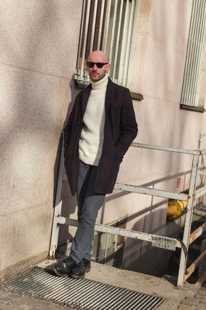 MILAN, ITALY - JANUARY 14: Fashionable man poses outside Antonio Marras fashion show building during Milan Men's Fashion Week on JANUARY 14, 2017 in Milan.のeditorial素材