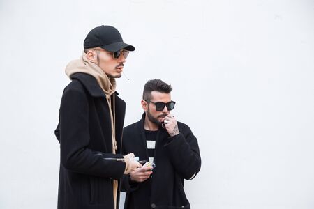 MILAN, ITALY - JANUARY 15: Fashionable people gather outside Damir Doma fashion show building during Milan Men's Fashion Week on JANUARY 15, 2017 in Milan.のeditorial素材