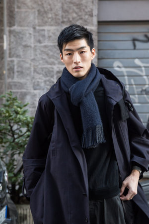 MILAN, ITALY - JANUARY 15: Fashionable man poses outside Damir Doma fashion show building during Milan Men's Fashion Week on JANUARY 15, 2017 in Milan.のeditorial素材