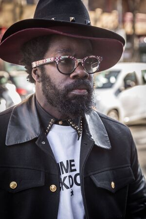 MILAN, ITALY - JANUARY 16: Fashionable man poses outside Etro fashion show building during Milan Men's Fashion Week on JANUARY 16, 2017 in Milan.のeditorial素材