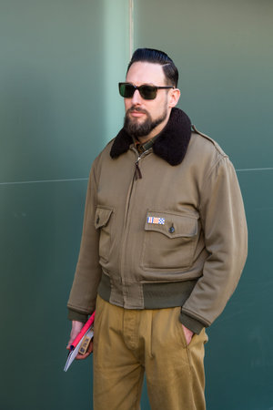 MILAN, ITALY - JANUARY 16: Fashionable man poses outside Etro fashion show building during Milan Men's Fashion Week on JANUARY 16, 2017 in Milan.のeditorial素材