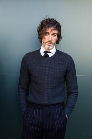 MILAN, ITALY - JANUARY 16: Fashionable man poses outside Etro fashion show building during Milan Men's Fashion Week on JANUARY 16, 2017 in Milan.のeditorial素材