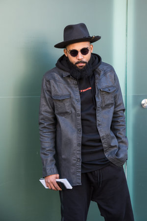 MILAN, ITALY - JANUARY 16: Fashionable man poses outside Etro fashion show building during Milan Men's Fashion Week on JANUARY 16, 2017 in Milan.のeditorial素材