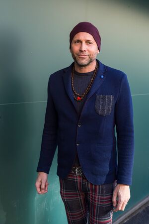 MILAN, ITALY - JANUARY 16: Fashionable man poses outside Etro fashion show building during Milan Men's Fashion Week on JANUARY 16, 2017 in Milan.のeditorial素材