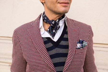 MILAN, ITALY - JANUARY 16: Detail of a fashionable man outside Etro fashion show building during Milan Men's Fashion Week on JANUARY 16, 2017 in Milan.のeditorial素材