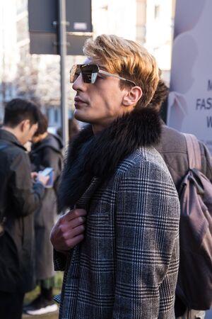 MILAN, ITALY - JANUARY 16: Fashionable man poses outside Etro fashion show building during Milan Men's Fashion Week on JANUARY 16, 2017 in Milan.のeditorial素材