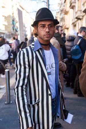 MILAN, ITALY - JANUARY 16: Fashionable man poses outside Etro fashion show building during Milan Men's Fashion Week on JANUARY 16, 2017 in Milan.のeditorial素材