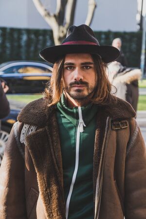 MILAN, ITALY - JANUARY 17: Fashionable man poses outside Armani fashion show building during Milan Men's Fashion Week on JANUARY 17, 2017 in Milan.のeditorial素材