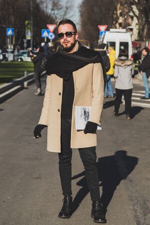 MILAN, ITALY - JANUARY 17: Fashionable man poses outside Armani fashion show building during Milan Men's Fashion Week on JANUARY 17, 2017 in Milan.のeditorial素材