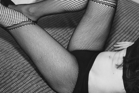 beautiful healthy body of a young attractive woman concept of sensuality and seductionの写真素材