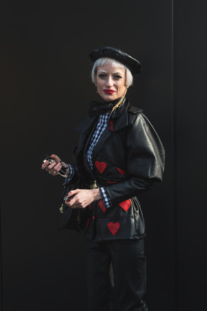MILAN, ITALY - FEBRUARY 22: Fashionable woman poses outside Gucci fashion show building during Milan Women's Fashion Week on FEBRUARY 22, 2017 in Milan.のeditorial素材