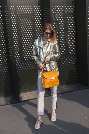 MILAN, ITALY - FEBRUARY 22: Fashionable woman poses outside Gucci fashion show building during Milan Women's Fashion Week on FEBRUARY 22, 2017 in Milan.のeditorial素材