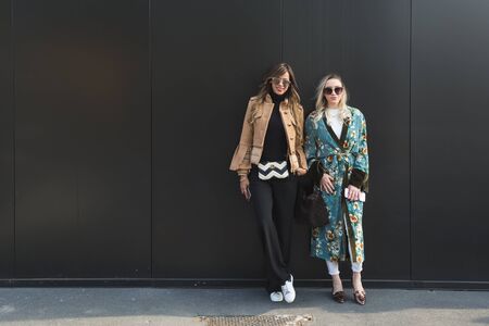 MILAN, ITALY - FEBRUARY 22: Fashionable women pose outside Gucci fashion show building during Milan Women's Fashion Week on FEBRUARY 22, 2017 in Milan.のeditorial素材