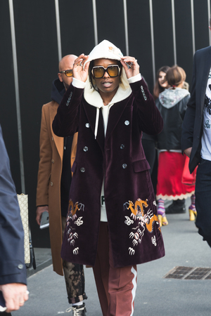 MILAN, ITALY - FEBRUARY 22: Fashionable man poses outside Gucci fashion show building during Milan Women's Fashion Week on FEBRUARY 22, 2017 in Milan.のeditorial素材